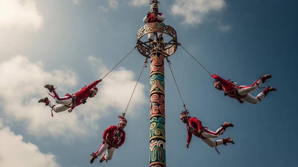 Ceremonia ritual de los Voladores de Papantla, con los danzantes descendiendo desde lo alto de un poste en una impresionante muestra de tradición prehispánica.